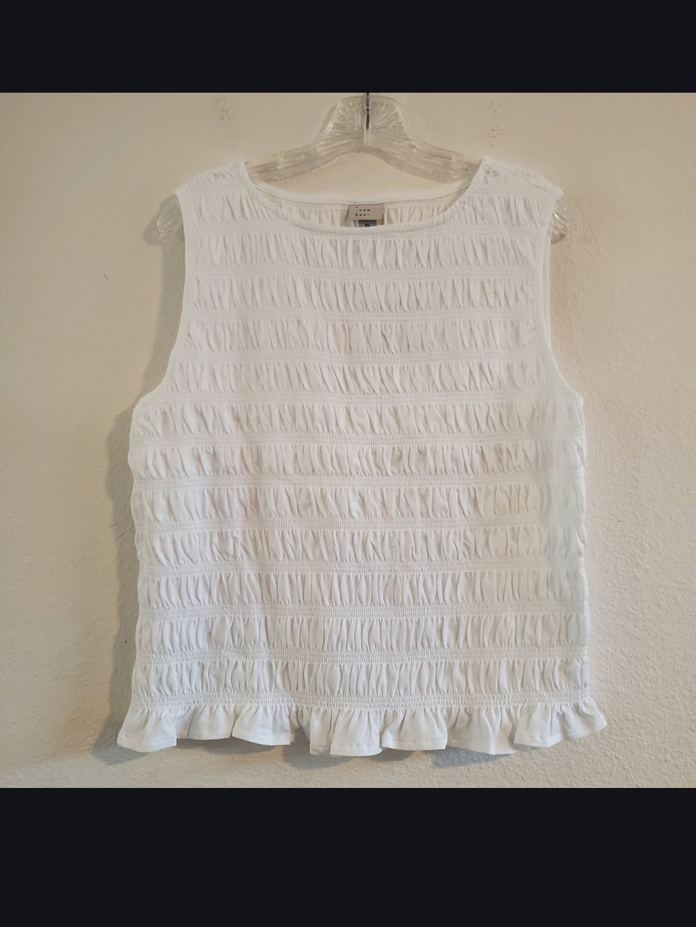 Women's White Sleeveless Ruffled Hem Top